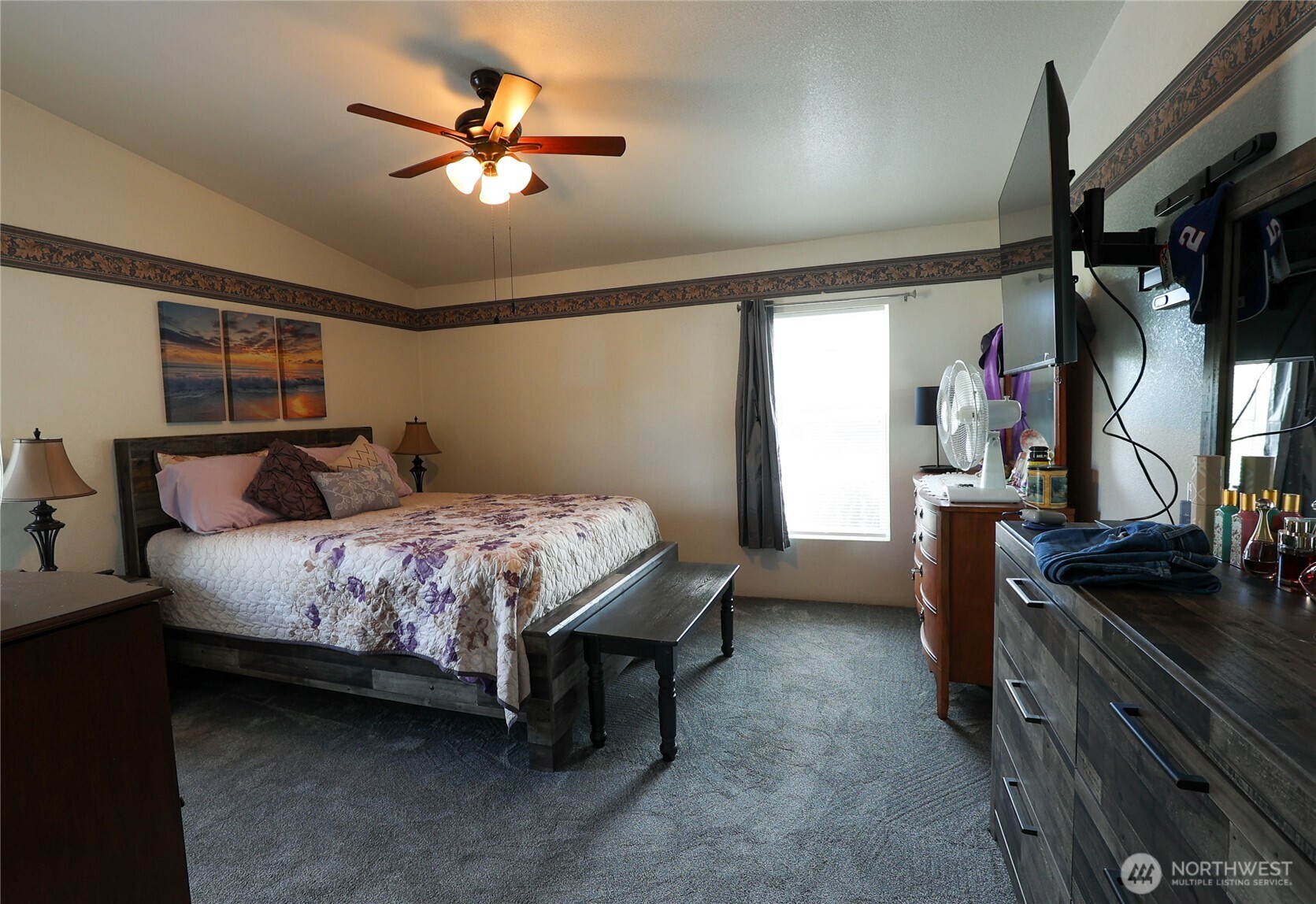 1427 100th Street Southwest, Unit 57 Everett, WA 98204 - Photo 17 of 38 a bedroom with a bed and a chandelier