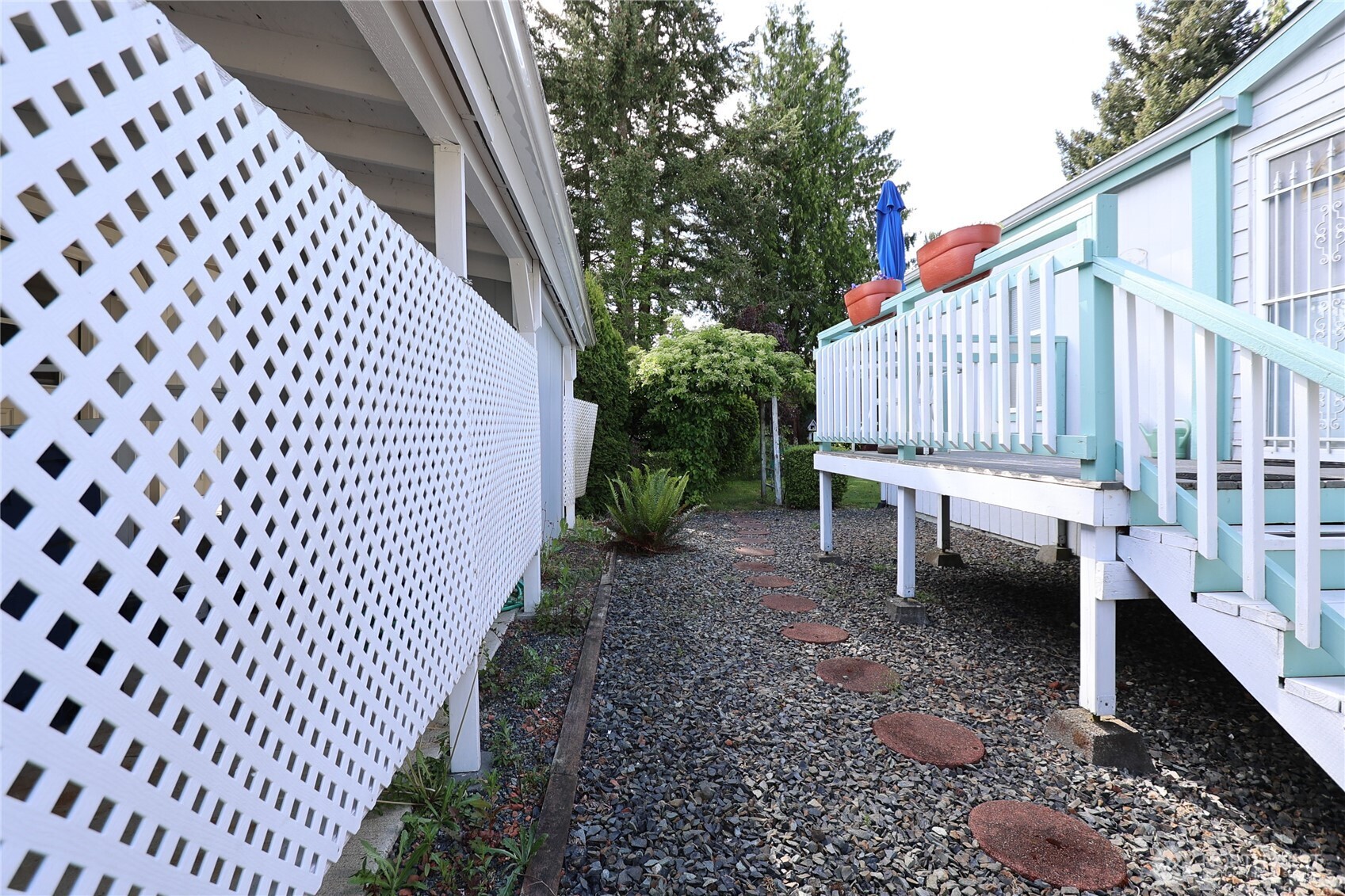 1427 100th Street Southwest, Unit 57 Everett, WA 98204 - Photo 27 of 38 a backyard of a house with outdoor seating