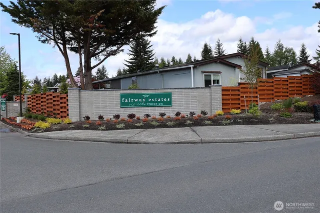 a front view of a house with garage