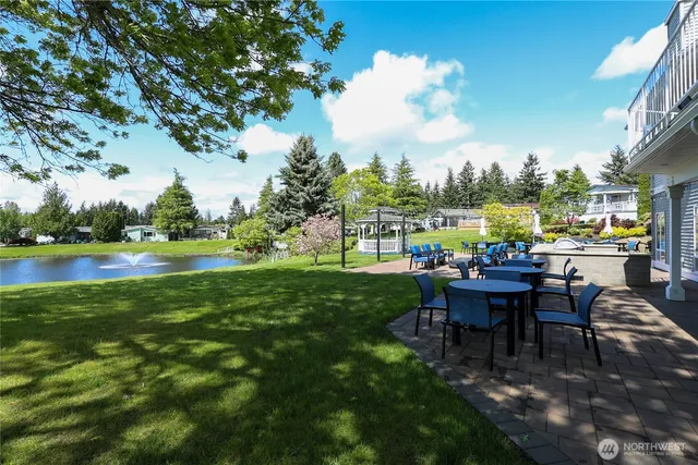 a view of a chairs and table in a garden