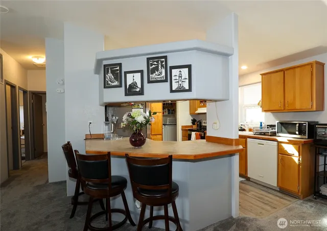 a dining table with chairs and window