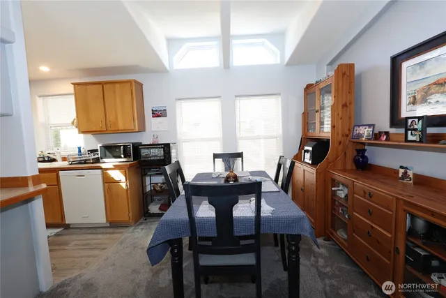 a view of a dining room with furniture and window