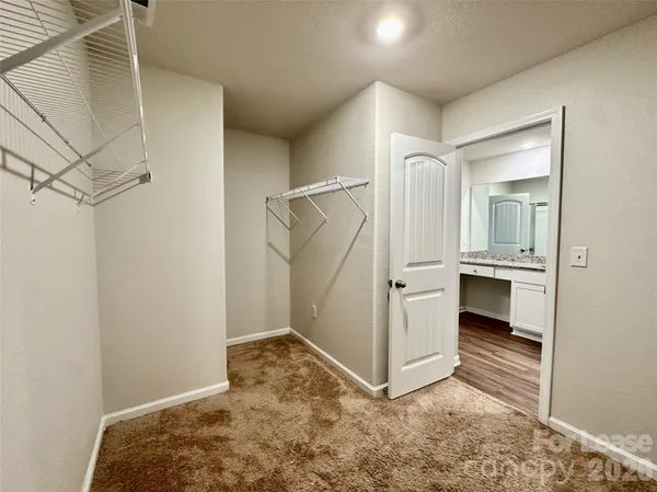 a view of walk in closet with window