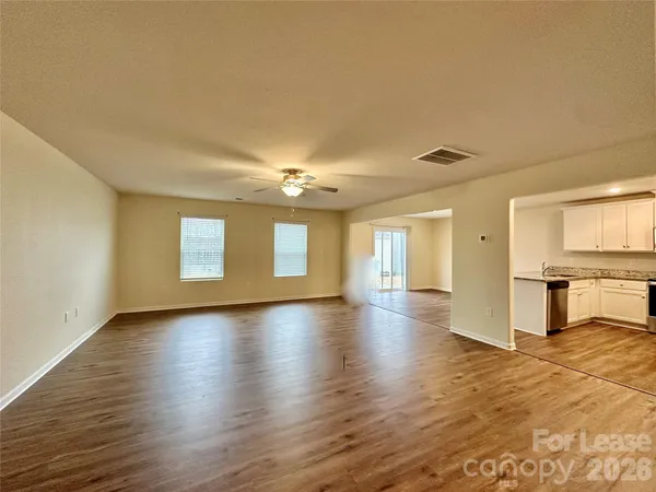 a view of a livingroom with wooden floor