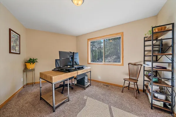 a workspace with furniture and window