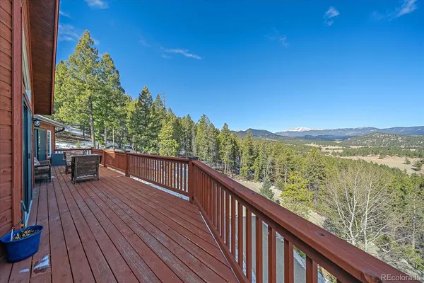 a view of balcony with furniture