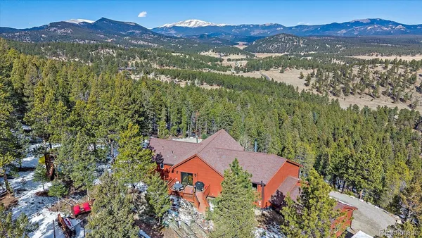a view of a house with a mountain