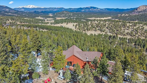 a view of a house with a mountain