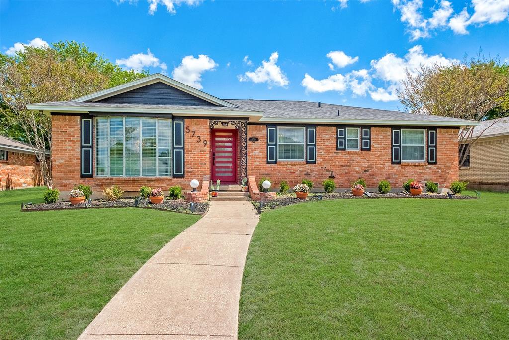5739 Banting Way Dallas, TX 75227 - Photo 1 of 15 a front view of a house with garden