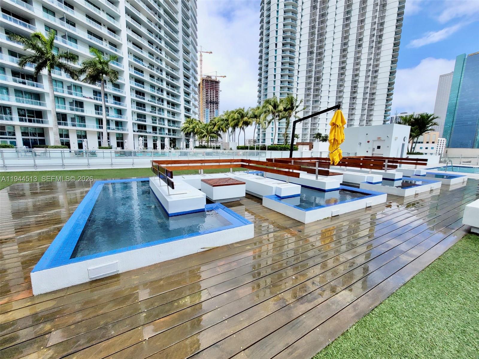 92 Southwest 3rd Street, Unit 1808 Miami, FL 33130 - Photo 1 of 45 a view of swimming pool with outdoor seating