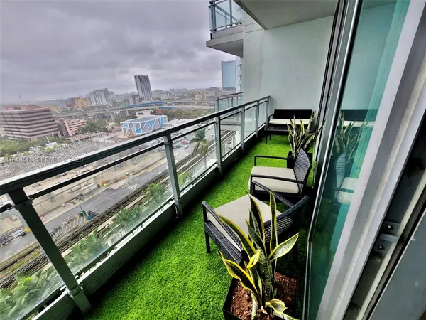 a view of a balcony with chairs