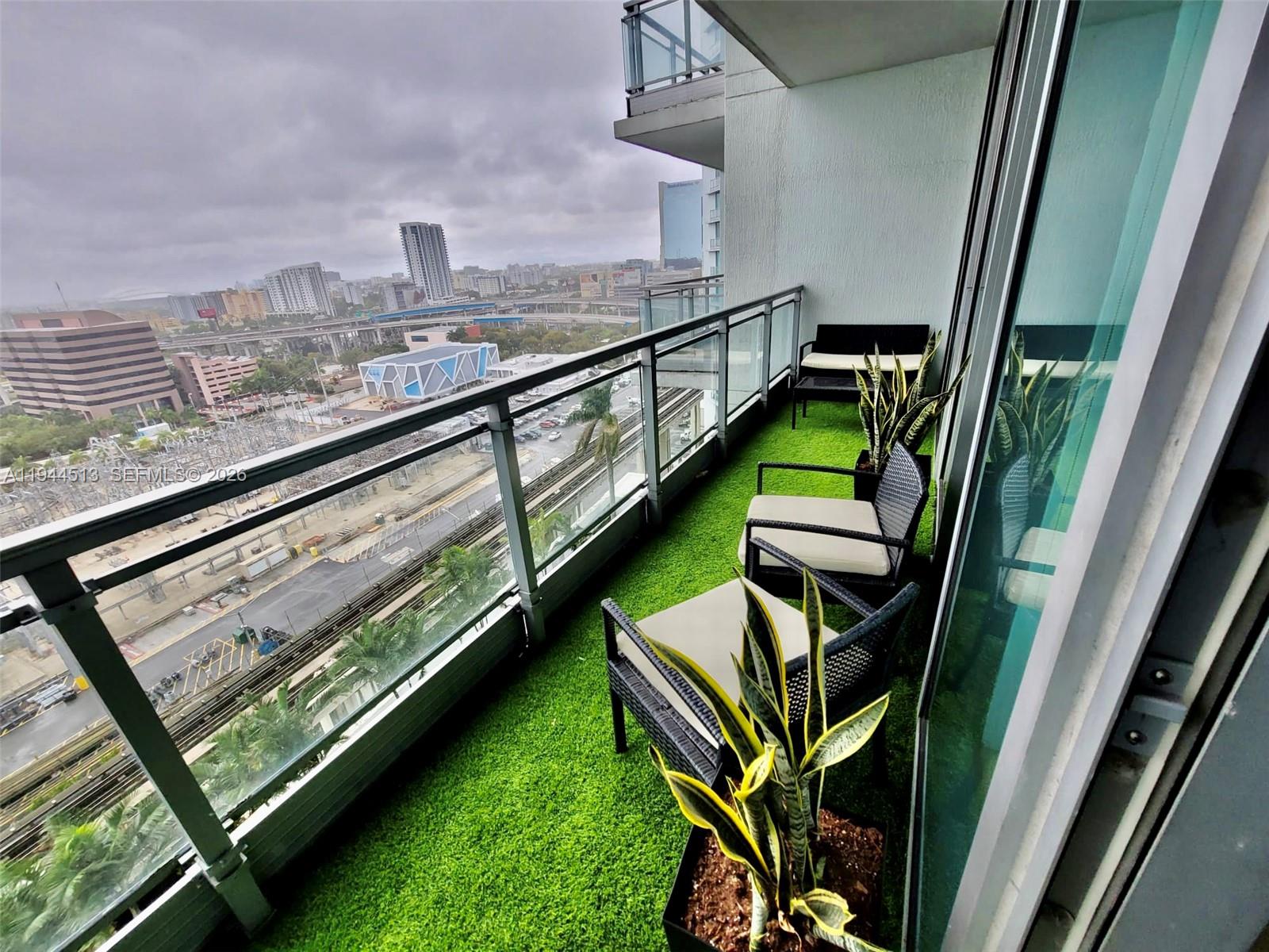92 Southwest 3rd Street, Unit 1808 Miami, FL 33130 - Photo 14 of 45 a view of a balcony with chairs