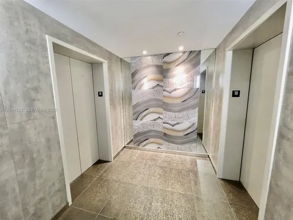 a view of a swimming pool with seating space