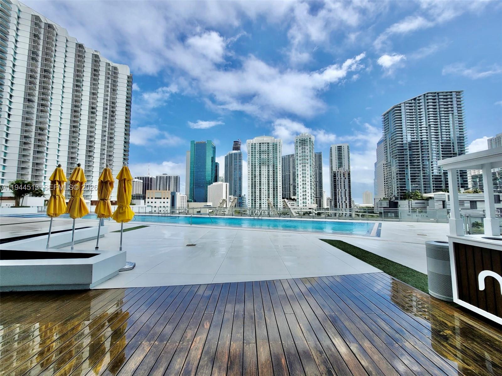 92 Southwest 3rd Street, Unit 1808 Miami, FL 33130 - Photo 20 of 45 a view of a swimming pool with seating space