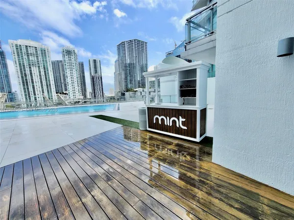 a view of swimming pool with outdoor seating