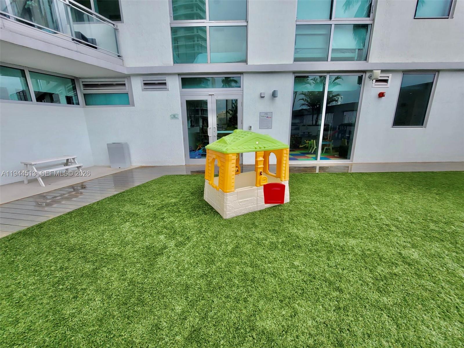 92 Southwest 3rd Street, Unit 1808 Miami, FL 33130 - Photo 32 of 45 a backyard of a house with seating space