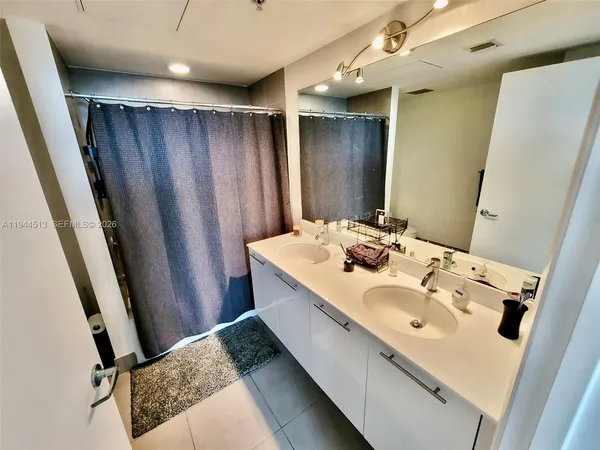 a bathroom with a sink and mirror