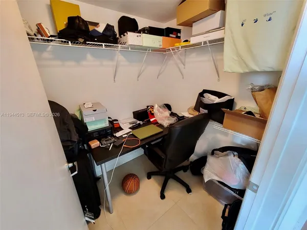 a view of storage and utility room with racks on the wall