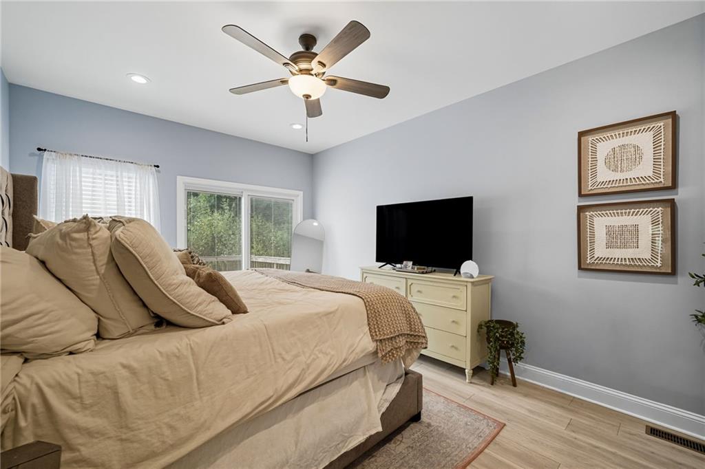 204 North Avenue Fairmount, GA 30139 - Photo 11 of 35 a bedroom with a bed and a flat screen tv
