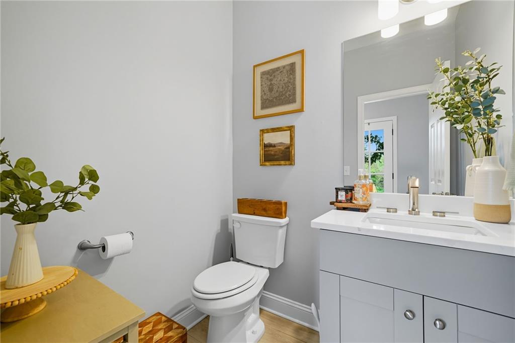 204 North Avenue Fairmount, GA 30139 - Photo 16 of 35 a bathroom with a toilet sink and mirror