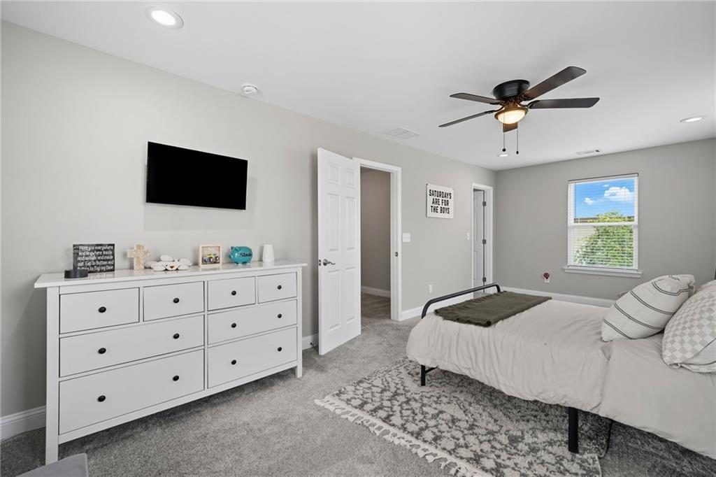 204 North Avenue Fairmount, GA 30139 - Photo 19 of 35 a bedroom with a bed a window and a flat screen television