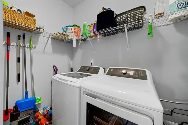 a utility room with dryer and washer