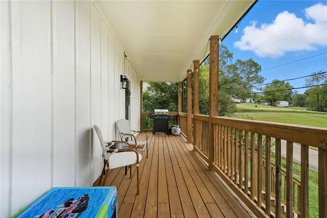 a view of balcony with furniture