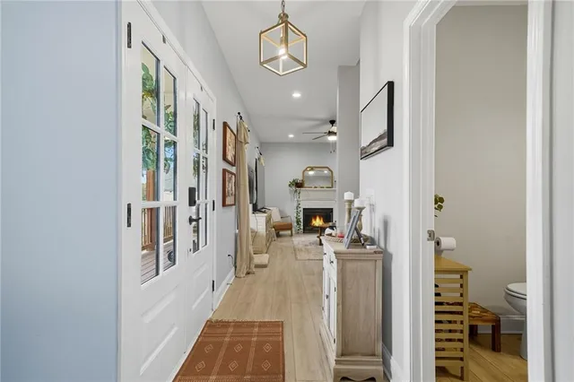 a view of a hallway with dining area and entryway