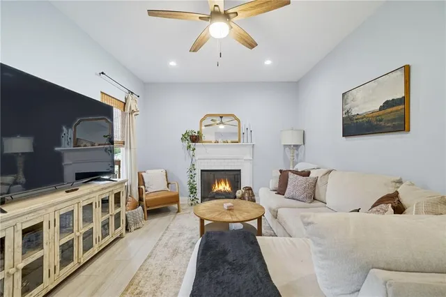 a living room with furniture and a fireplace