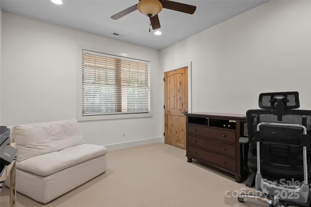 a living room with furniture and flat screen tv