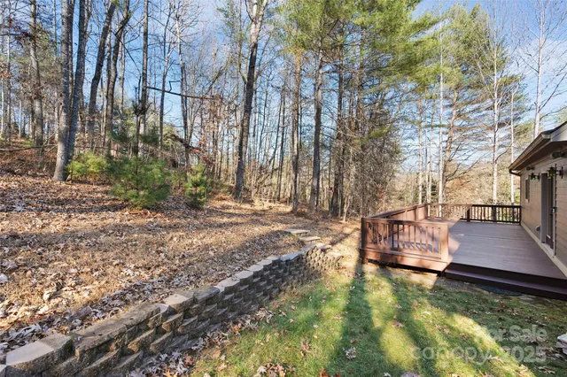 a view of a swimming pool with chairs and tables