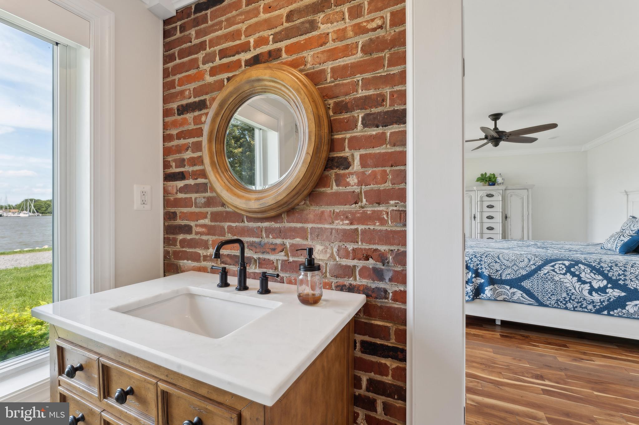 1045 Back Bay Beach Road West River, MD 20778 - Photo 21 of 33 a bathroom with a sink and a mirror