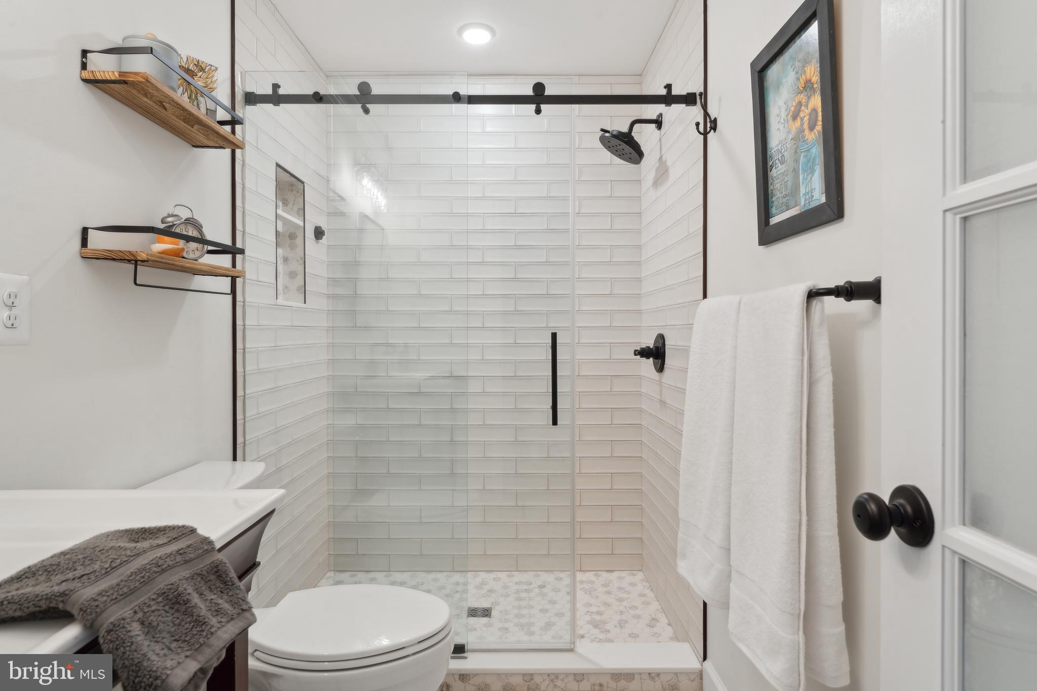 1045 Back Bay Beach Road West River, MD 20778 - Photo 23 of 33 a bathroom with a shower a toilet and a shower