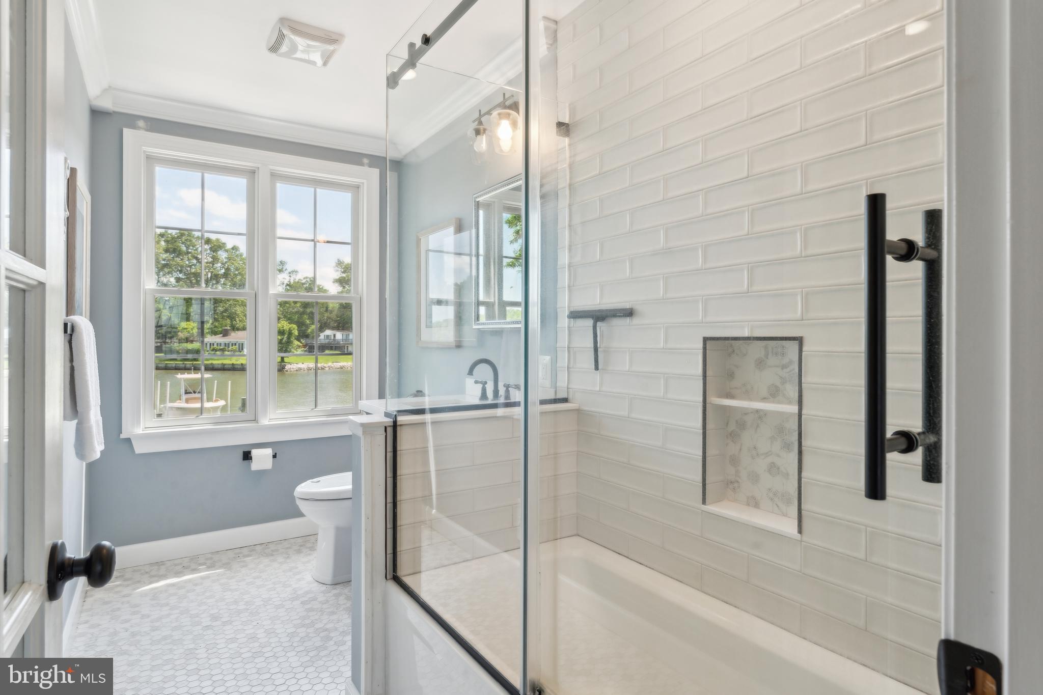 1045 Back Bay Beach Road West River, MD 20778 - Photo 28 of 33 a bathroom with a bathtub and a shower