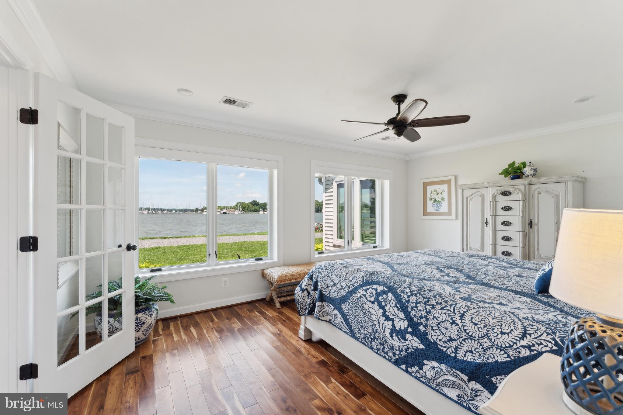 1045 Back Bay Beach Road West River, MD 20778 - Photo 5 of 33 a living room with a bed furniture and a large window