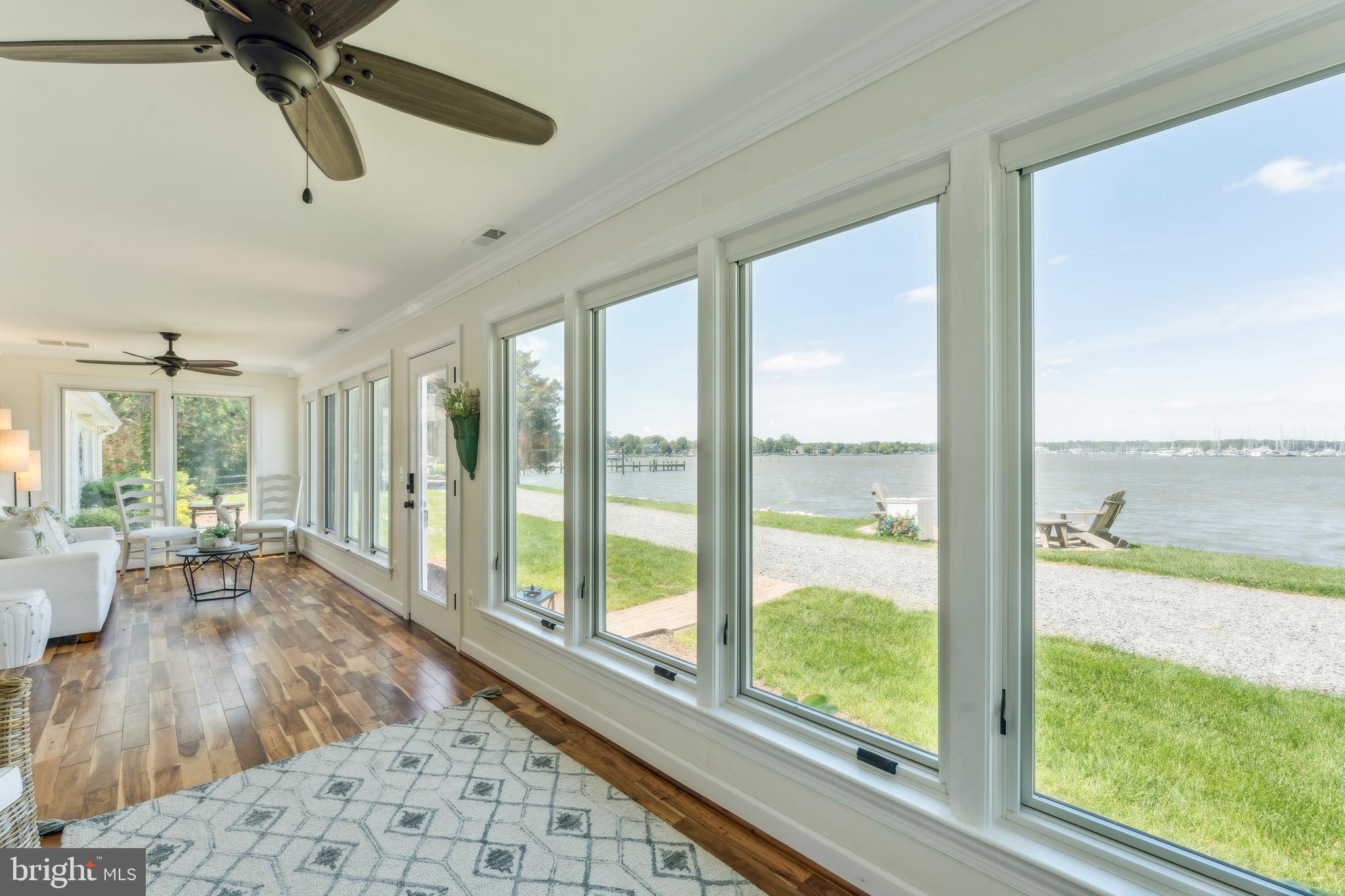 1045 Back Bay Beach Road West River, MD 20778 - Photo 7 of 33 a living room with hardwood floor and a large window