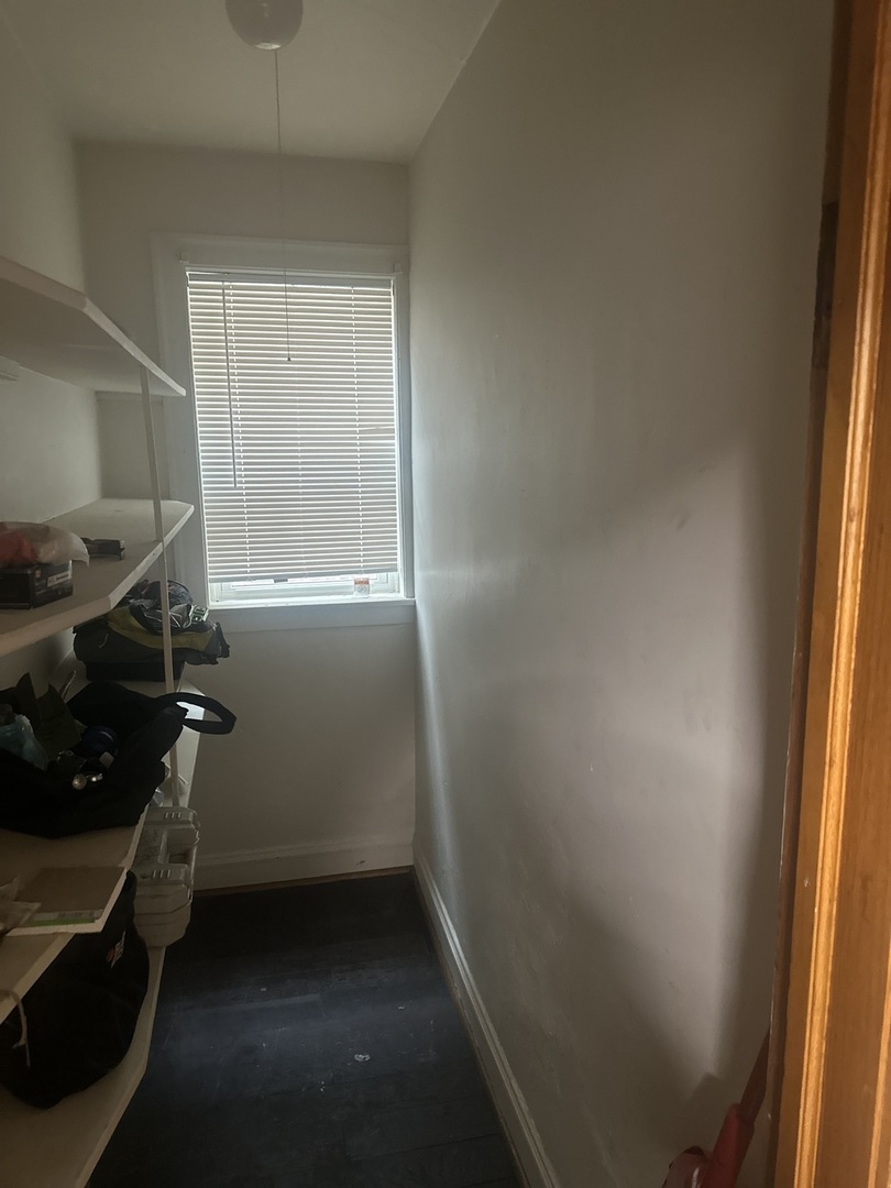 6837 South Maplewood Avenue, Unit 1R Chicago, IL 60629 - Photo 13 of 16 an empty room with windows