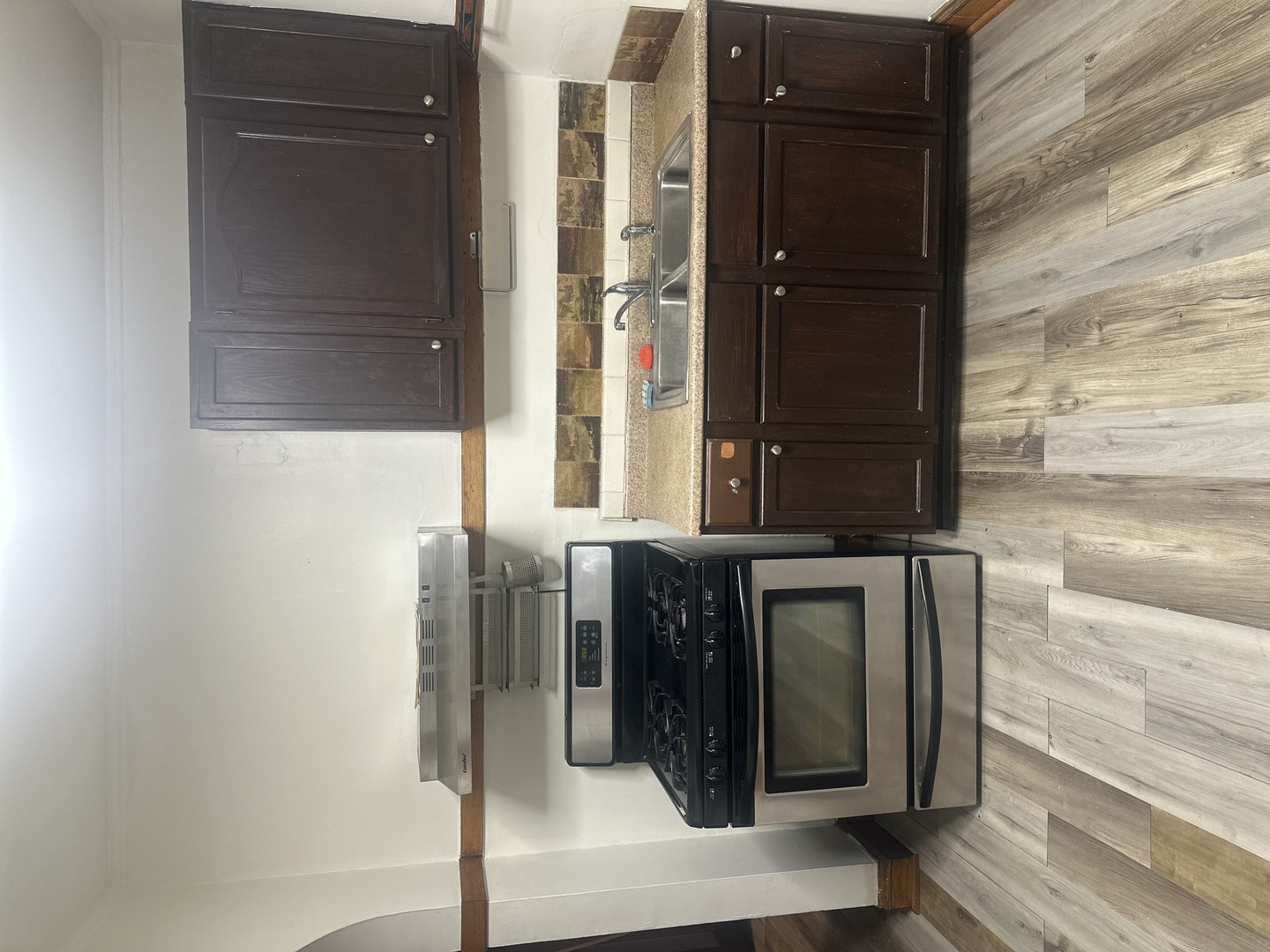 6837 South Maplewood Avenue, Unit 1R Chicago, IL 60629 - Photo 9 of 16 a bathroom with a mirror and a shower