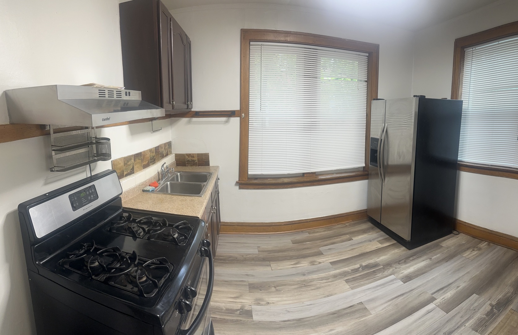 6837 South Maplewood Avenue, Unit 1R Chicago, IL 60629 - Photo 10 of 16 a kitchen with wooden floor and a stainless steel appliances