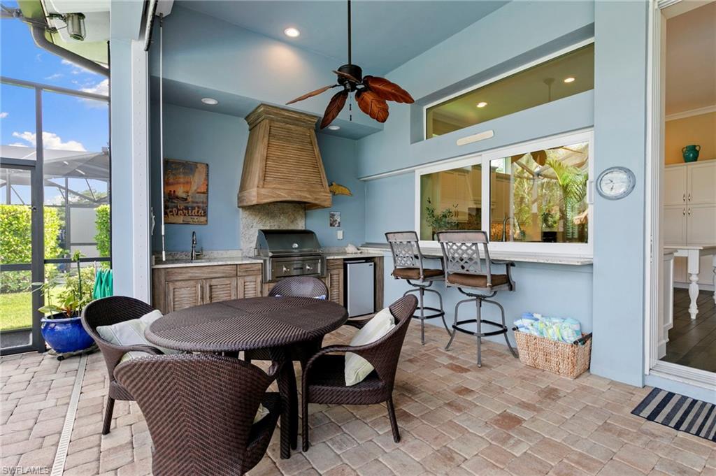 4922 Andros Drive Naples, FL 34113 - Photo 18 of 44 a view of a dining room with furniture window and outside view