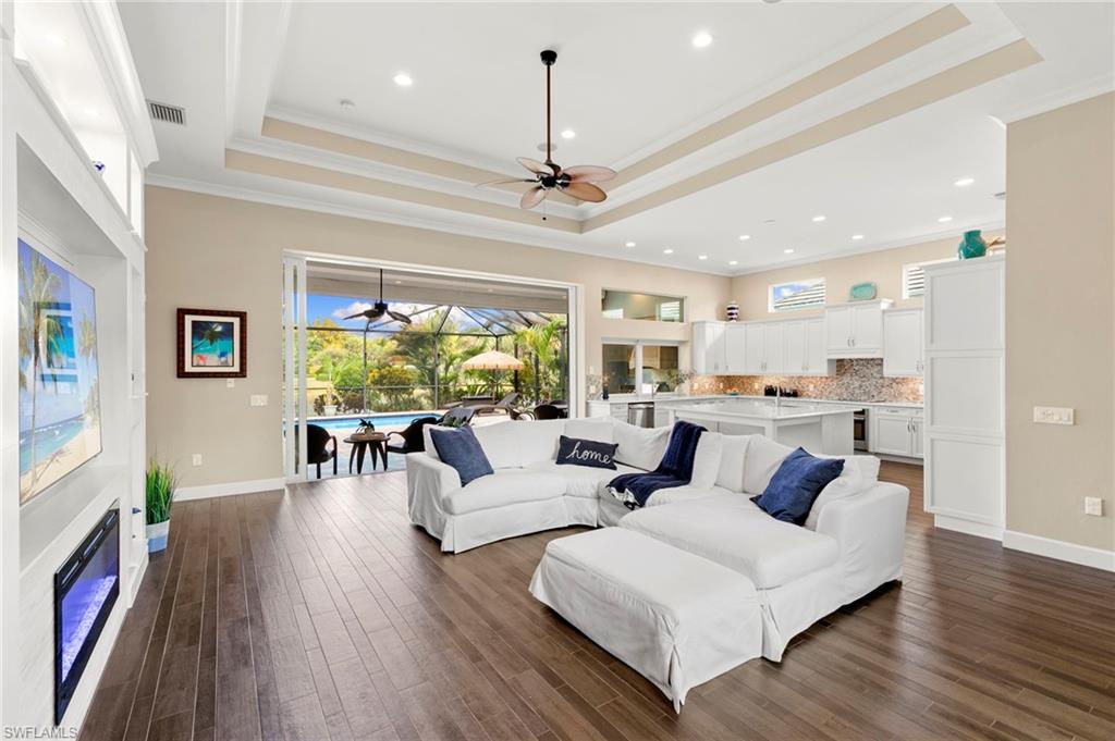 4922 Andros Drive Naples, FL 34113 - Photo 4 of 44 a living room with furniture and a large window