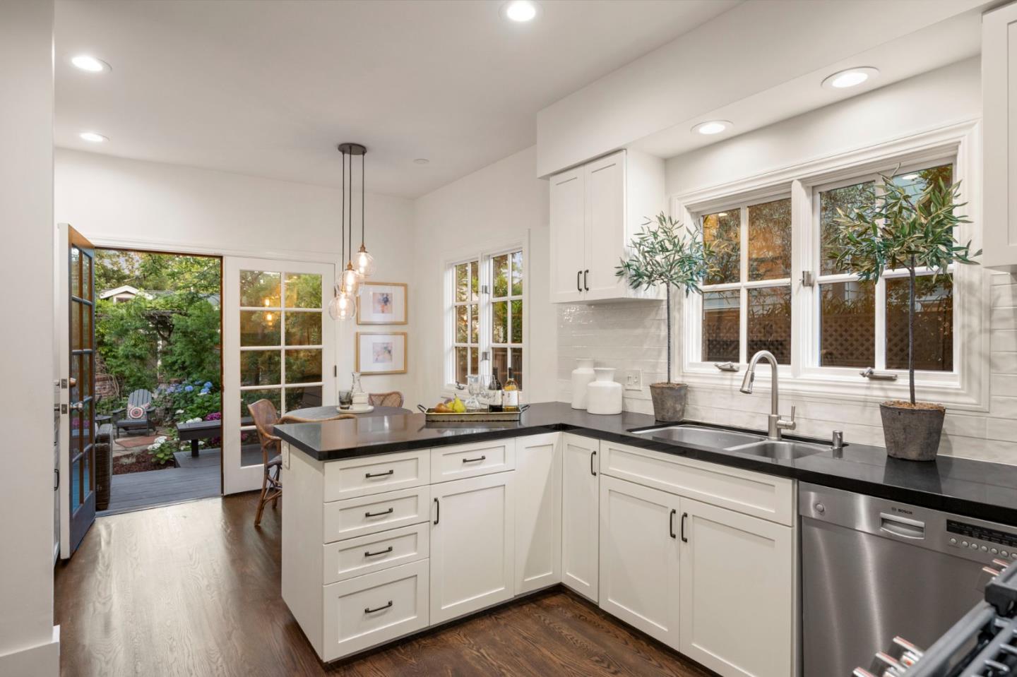 445 Arlington Road Redwood City, CA 94062 - Photo 39 of 50 a kitchen with stainless steel appliances a sink and large window