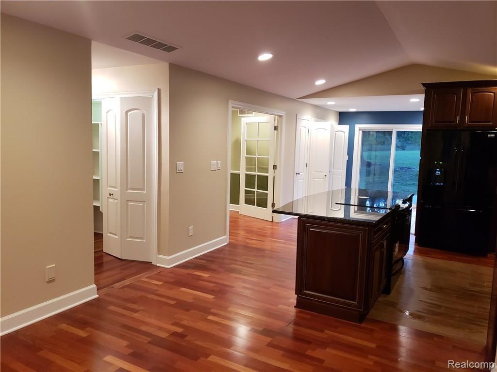 7665 Clintonville Road Clarkston, MI 48348 - Photo 7 of 28 brazilian cherry flooring.jpg
