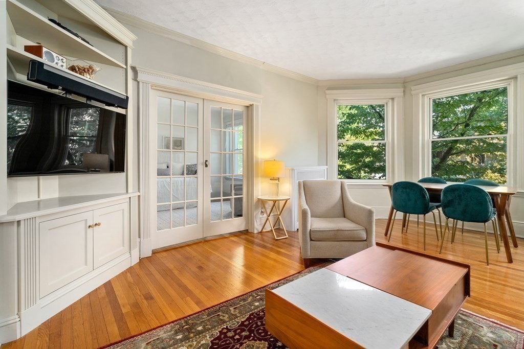 89 Mason Terrace, Unit 3 Brookline, MA 02446 - Photo 1 of 19 a living room with furniture and a flat screen tv