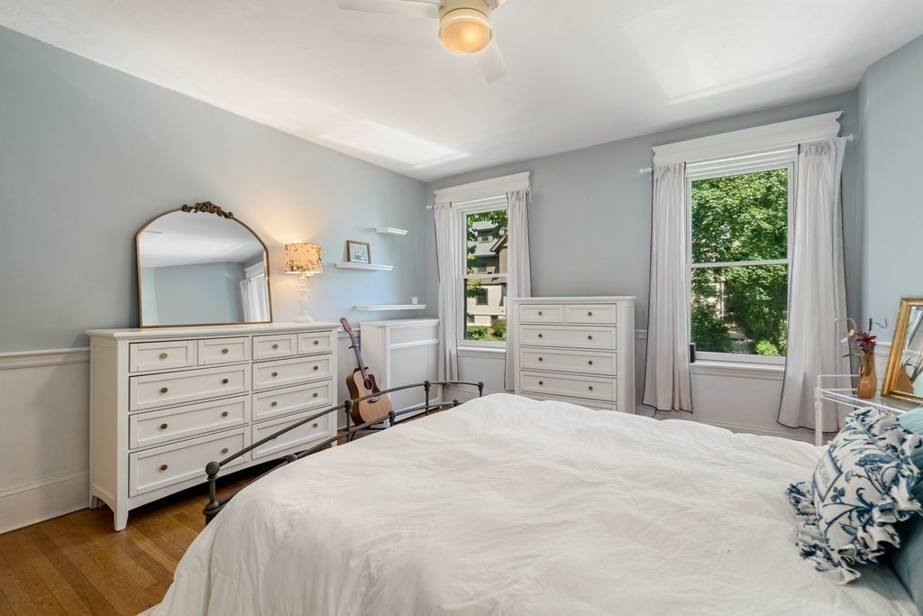 89 Mason Terrace, Unit 3 Brookline, MA 02446 - Photo 11 of 19 a bedroom with a bed and a dresser