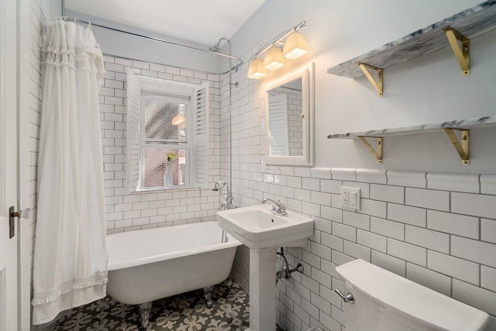89 Mason Terrace, Unit 3 Brookline, MA 02446 - Photo 12 of 19 a bathroom with a sink toilet and shower