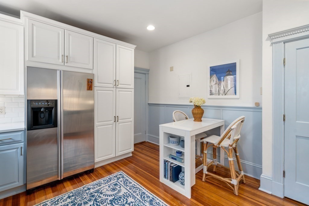89 Mason Terrace, Unit 3 Brookline, MA 02446 - Photo 15 of 19 a kitchen with stainless steel appliances granite countertop a refrigerator a stove and a cabinets with wooden floor