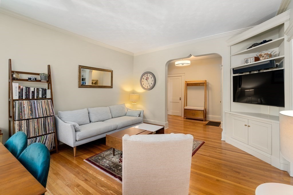 89 Mason Terrace, Unit 3 Brookline, MA 02446 - Photo 3 of 19 a living room with furniture and a flat screen tv