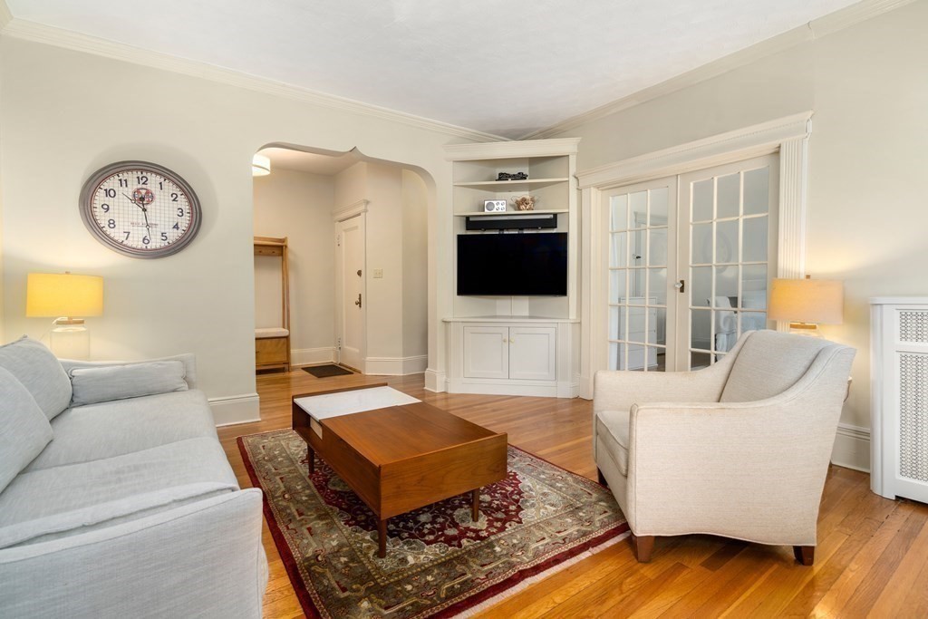 89 Mason Terrace, Unit 3 Brookline, MA 02446 - Photo 4 of 19 a living room with furniture and a flat screen tv