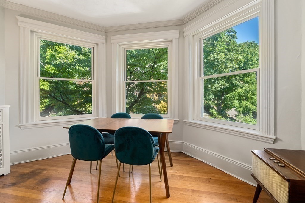 89 Mason Terrace, Unit 3 Brookline, MA 02446 - Photo 5 of 19 a dining room with furniture and wooden floor